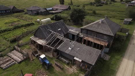 aerial view of a rural village with wooden houses and farm buildings
