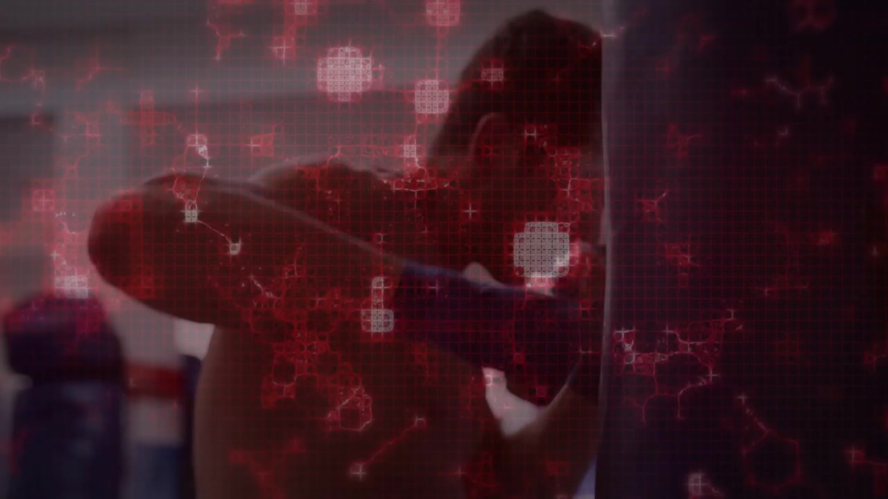 Male boxer shifting weight and sending jabs into bag in training gym, red overlay tracking impact
