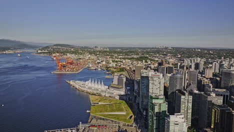 vancouver bc canada aerial v35 drone flyover the harbour capturing landmark canada place, waterfront downtown cityscape and eastside centerm container terminal - shot with mavic 3 pro cine - july 2023