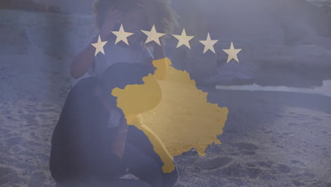 animation of person sitting on rocky ground with golden kosovo map and stars