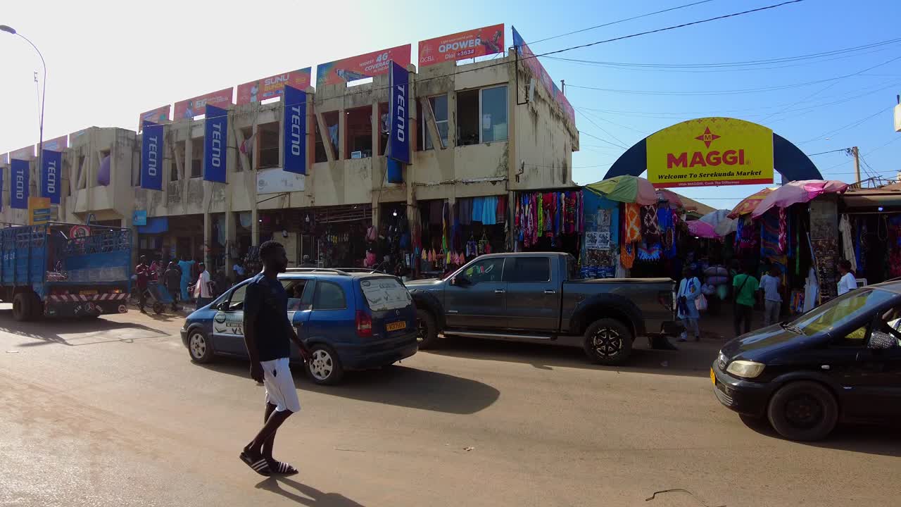 Traffic road in front of main entrance Serekunda market