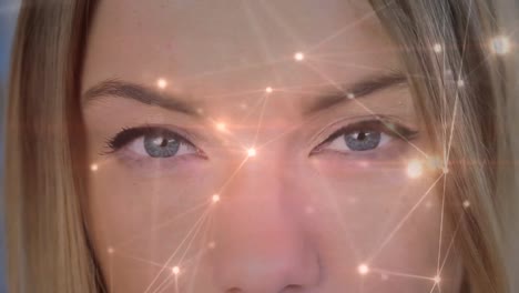 conexiones de luz moviéndose en un fondo con una mujer abriendo los ojos