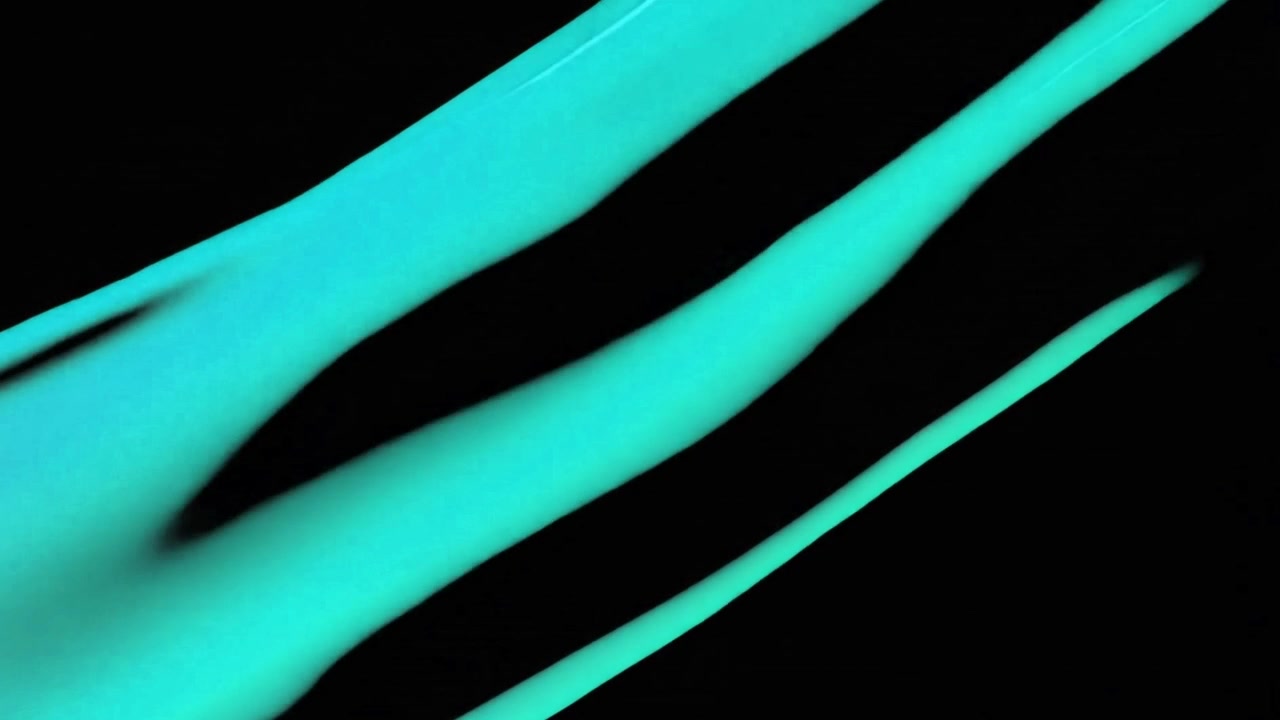 Abstrakt bevægelse af røde og cyan væskestrømme på sort baggrund