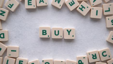 Creating-the-word-"Buy"-with-green-letters