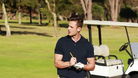 golfer writing on paper