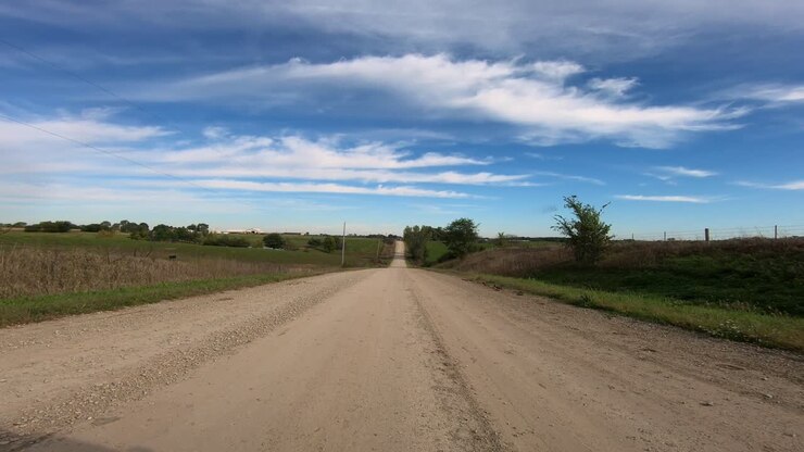 POV through driver's window while driving through rural Iowa