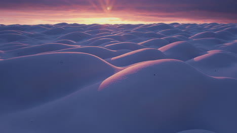 sunset over rolling dunes