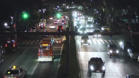 light traffic on the road at night in tokyo, japan near harajuku - high angle shot