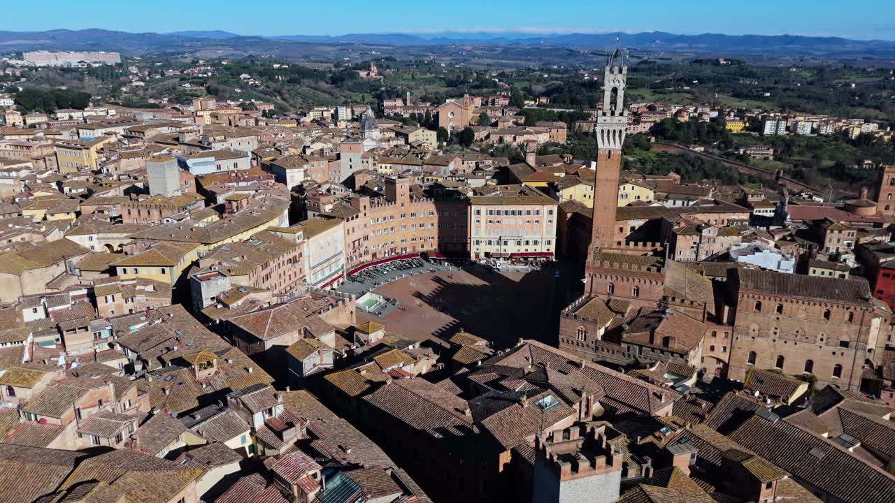 Medieval city of Siena, Italy, aerial view of Piazza del Campo and Torre del Mangia