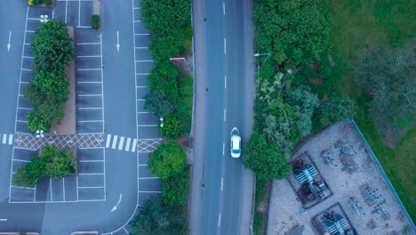 4k aerial drone footage looking directly down at main road in thetford with moving traffic, norfolk, england