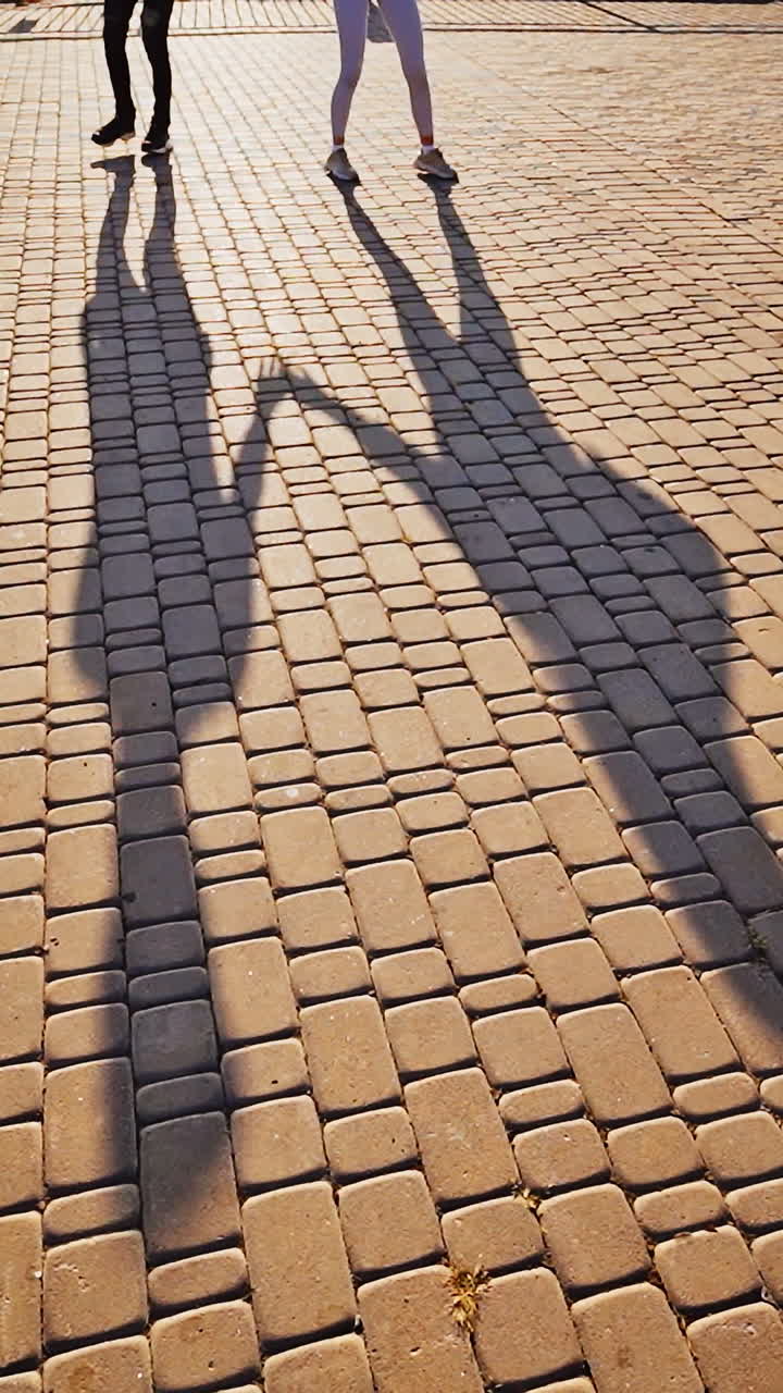 Couple dancing in the street. Vertical video