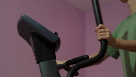 person using a cross trainer