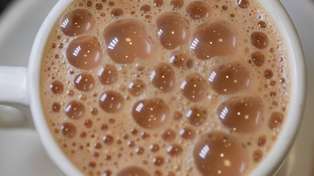 Close-up of foamy coffee in a cup