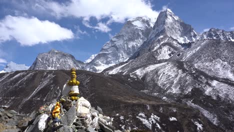 a beautiful view of the himalaya mountains in the everest region of nepal with a stupa in the foreground