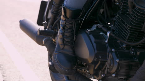 close up of a moto biker boot on a motorcycle