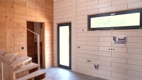 wooden interior walls and staircase in modern minimalist house under construction