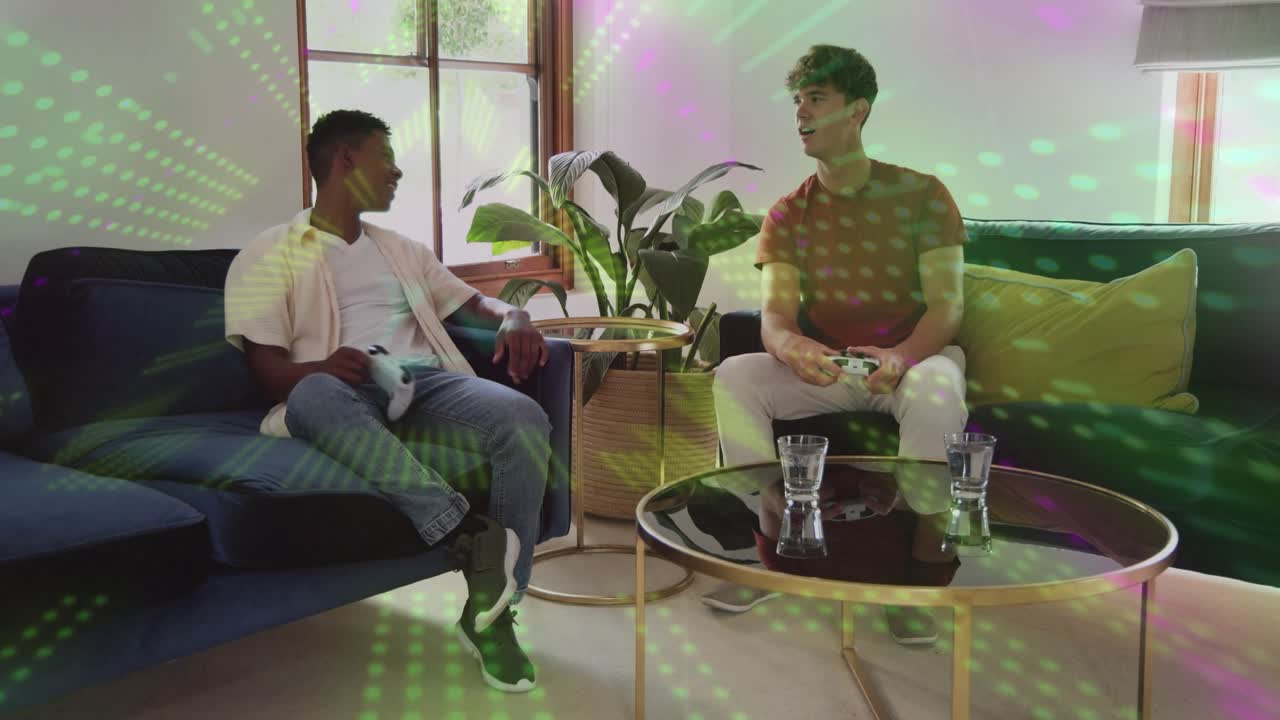 Two men pressing white pads and reacting to gaming as green-purple dotted light pulsing across men