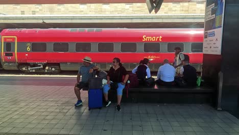 people seated and standing near a train