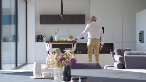 luxury living: man's reflection in opulent villa with touch of nature