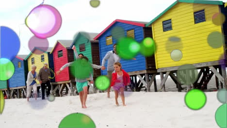 manchas móviles de luz de color con la familia en la playa