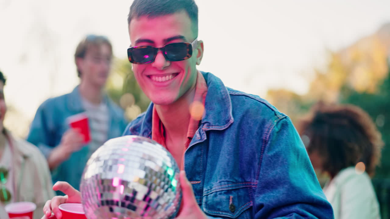 Group of friends celebrating with a disco ball