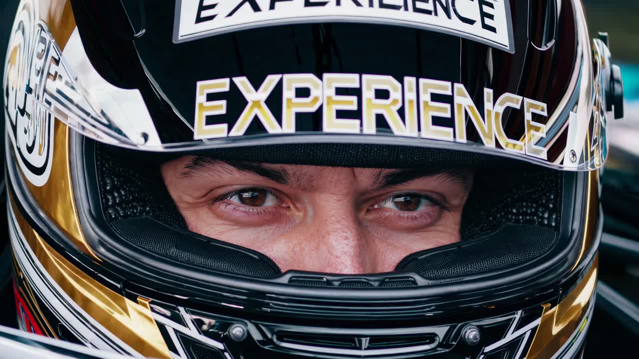 Close-up of a race car driver in their helmet