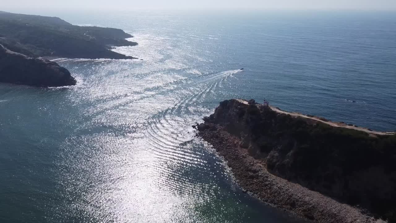 Aerial View of a Boat Leaving an Inlet into the Atlantic Ocean on a Bright Sunny Day