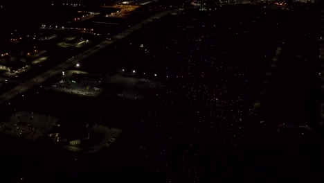 aerial shot of fireworks with city lights in the background.  city night lights.  4k footage.