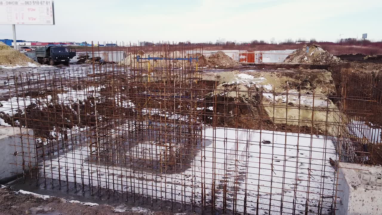 Construction Site Foundation Work in Winter