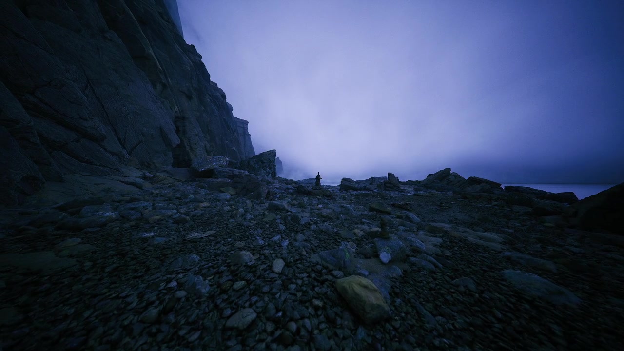 Individual with backpack explores rugged shoreline at dusk with blue tones