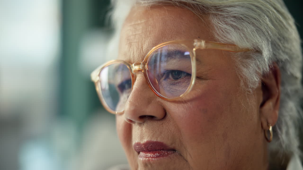Close-up of a senior woman wearing glasses