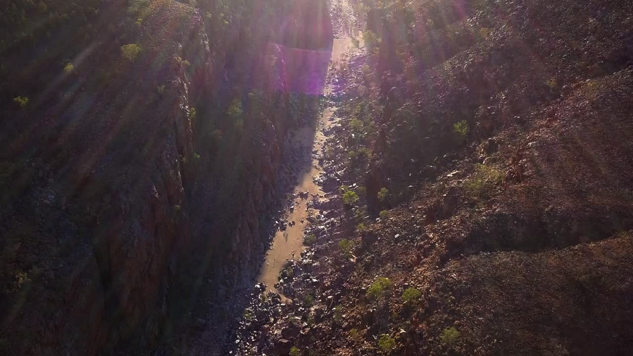 Kings Canyon Australia, drone flying over rocky valley at sunrise