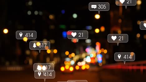 animation of social media icons and numbers over out of focus city and road traffic lights