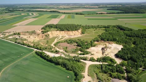 An-Old-Sand-Mine-in-Proximity-to-the-Town-of-Prudnik,-Poland---Orbit-Drone-Shot