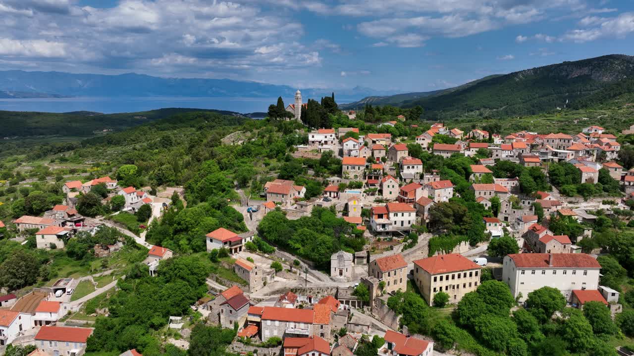 Vrisnik Mountaintop Village in Hvar Island in Croatia - Aerial Reveal