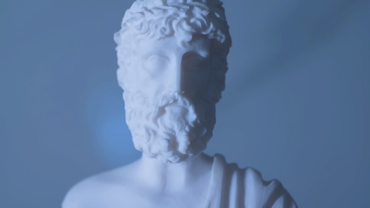 Rotating statue of the Greek God Zeus in warm light