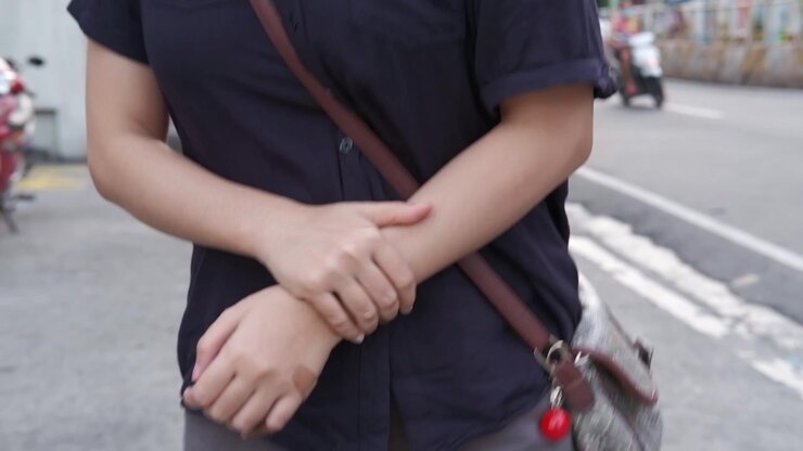 Cropped View Of A Young Girl Walking On The Street Feeling Afraid. Close Up