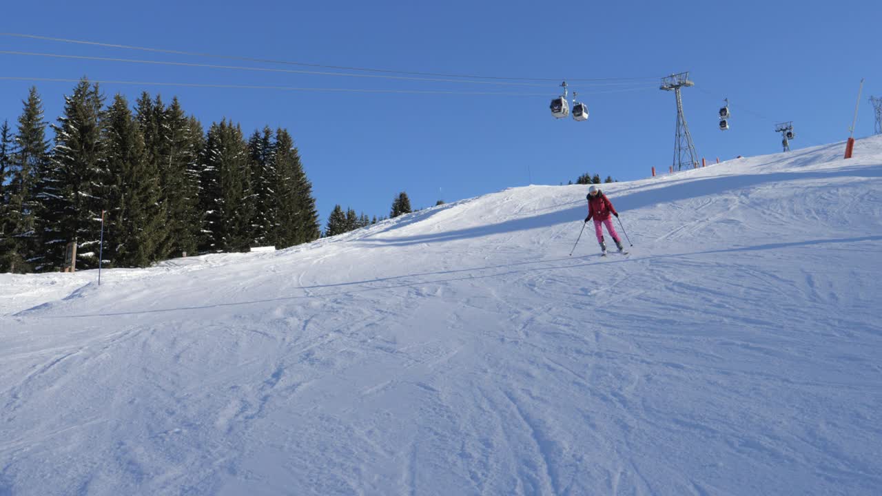 Skier Skiing Down Carving On The Slope In The Mountains Background The Funicular
