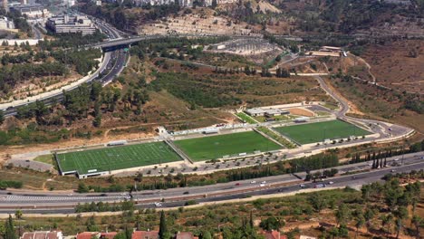 aerial view of sports complex and cityscape