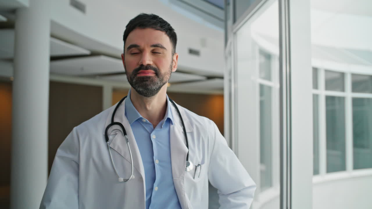 Medical worker going clinic with stethoscope. Closeup smiling man looking camera
