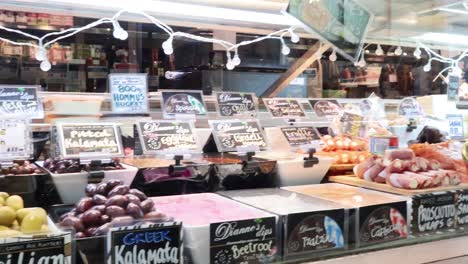 variety of olives and deli items displayed