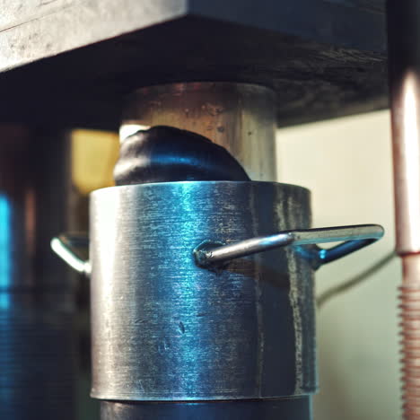 industrial press machinery. powerful press creates the shape of the detail. close-up shot.