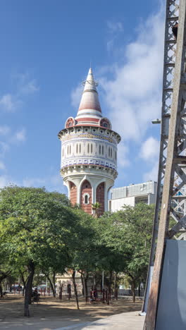 timelpase of ornate old water tower in barcelona in vertical