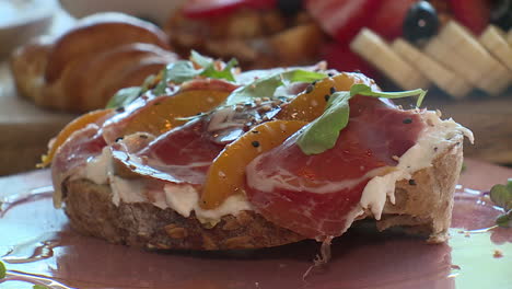 peach and prosciutto toast
