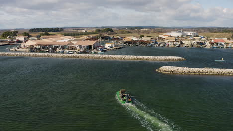 Mourre-Blanc-shellfish-port-harbor-Etang-de-Thau-aerial-drone-shot-following