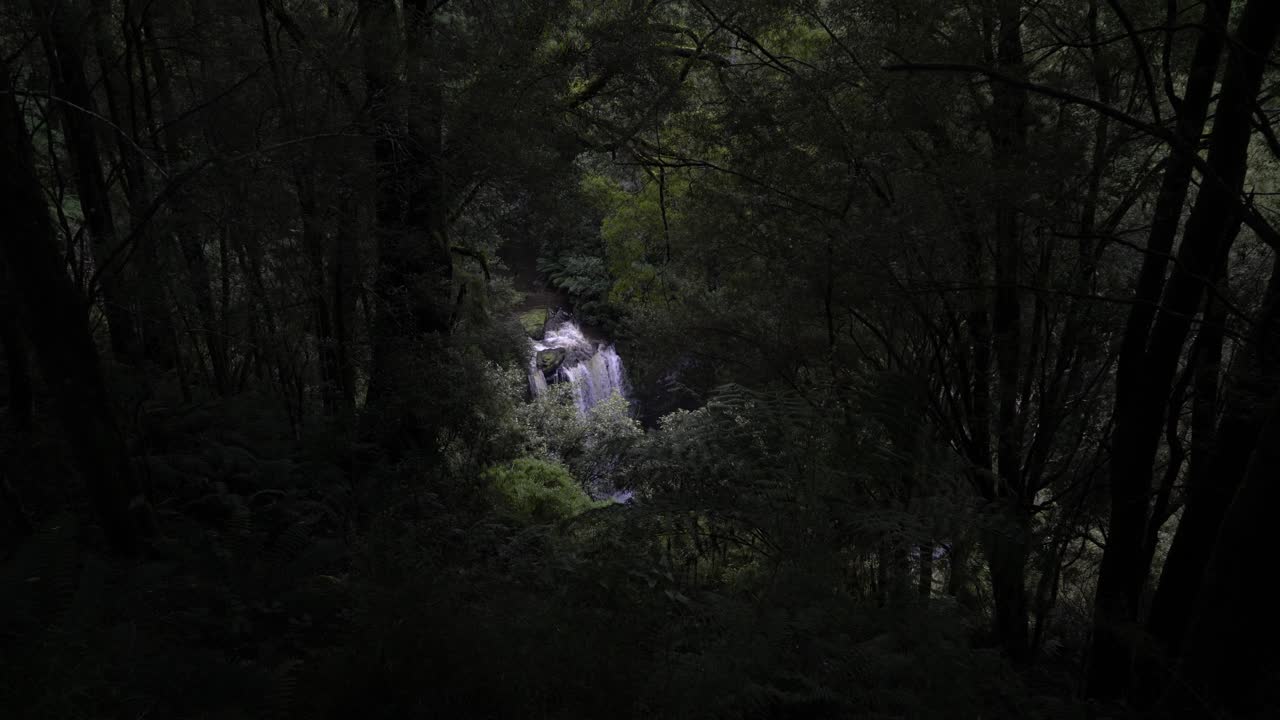 Distance waterfall in the rainforest amongst the greenery