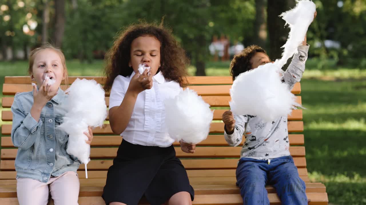 Kids Enjoying Cotton Candy in Park