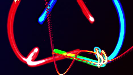 animation of blue, green and red light trails moving on black background