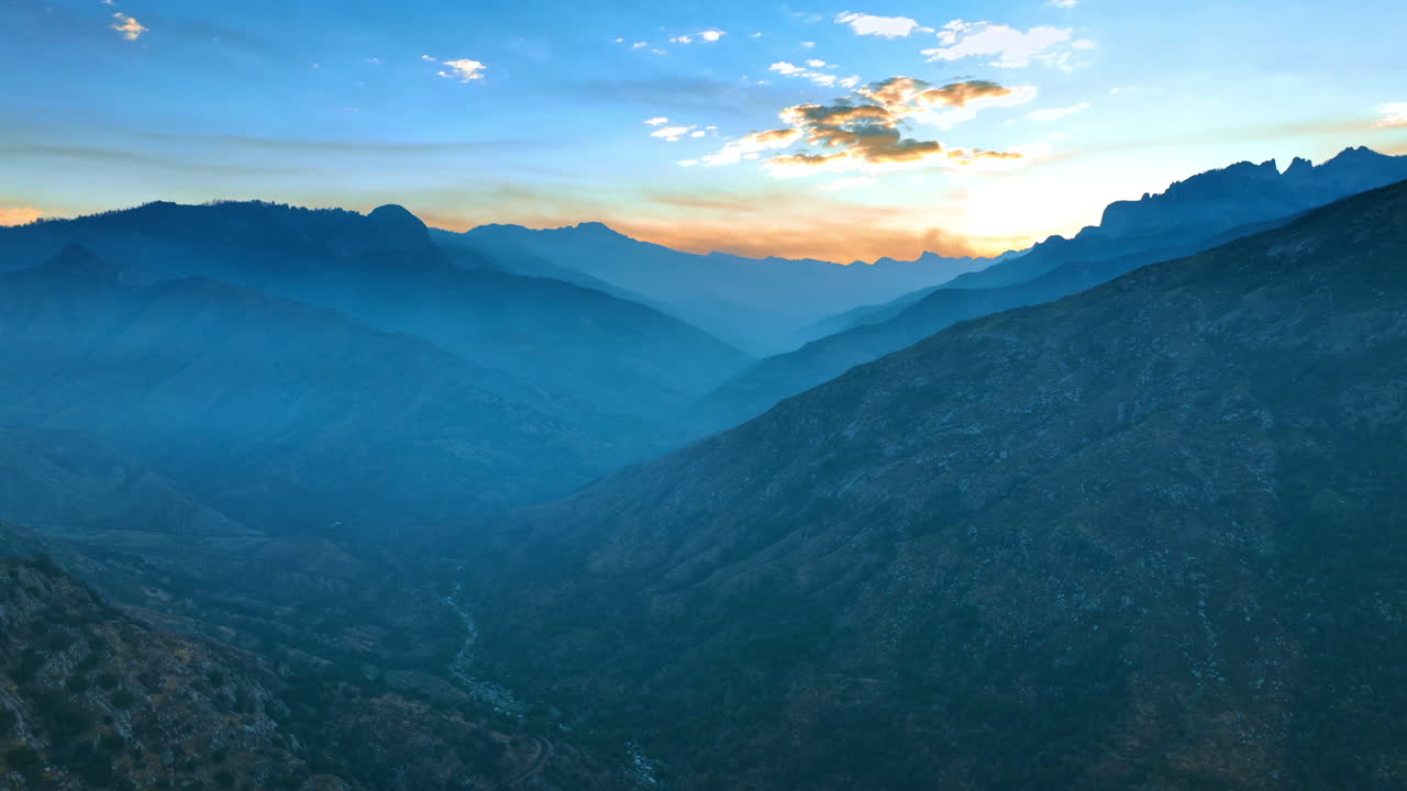 Beautiful view of the California mountains in the blue haze. Sunset in the sky at backdrop.