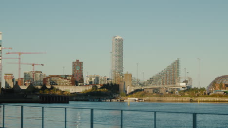 modern cityscape view of aarhus waterfront with unique architecture. perfect for travel documentaries highlighting denmark’s urban design.